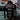Person wearing a black hoodie with 'Chrome' branding in a garage setting