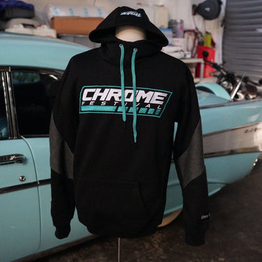 Black hoodie with 'Chrome' logo in a garage setting