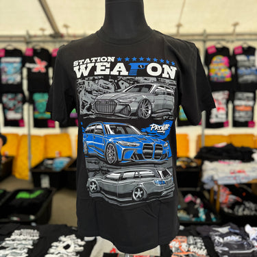 Black t-shirt with car graphics and text on a mannequin in a store setting. Audi RS6 Avant, BMW M3 Touring Competition and Mercedes AMG E63 Wagon/Estate in Blue, Grey and White