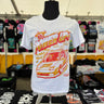 White t-shirt with 'Power Up' graphic design on a mannequin in a store setting.